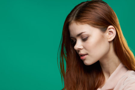 pretty woman attractive look luxury cropped view studio green backgroundの写真素材