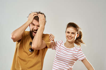 Young couple socializing romance lifestyle fashion fun light backgroundの写真素材