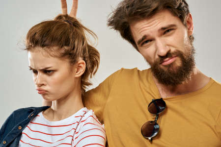 Young couple lifestyle emotions communication fashion light backgroundの写真素材