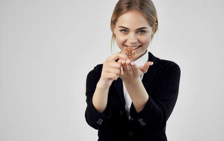 Business woman cryptocurrency bitcoin e-commerce finance gray backgroundの写真素材