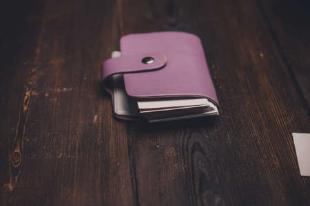 business card holder on a wooden table accessories finance storage cardsの写真素材
