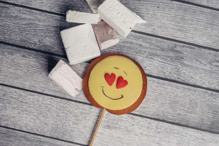 gingerbread in the form of a smiley on a stick sweets candy dessert delight snack. High quality photoの写真素材