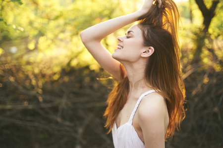woman travels on nature in forest white sundress cropped viewの写真素材