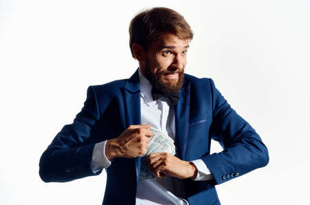 a man in a classic suit with a wad of money banknote business finance model