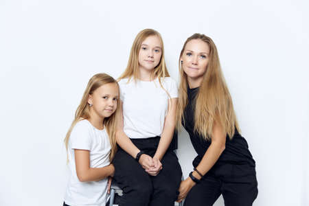mom with two daughters family photo joy friendship