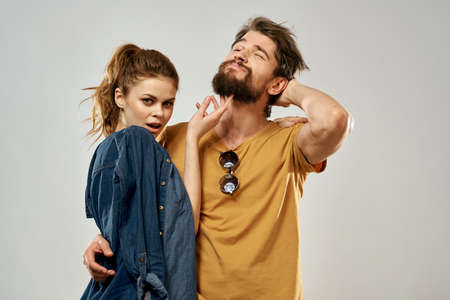 Young couple lifestyle emotions communication fashion light backgroundの写真素材