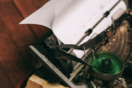 vintage typewriter for printing white sheet of paper wooden background retro inventionの写真素材