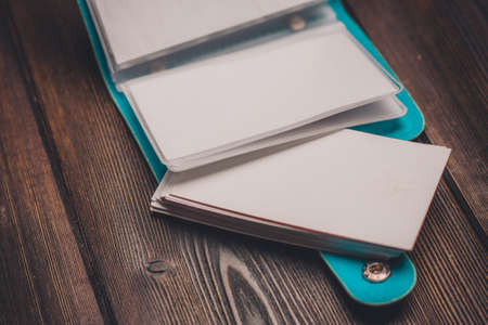 business card holder society finance wooden backgroundの写真素材