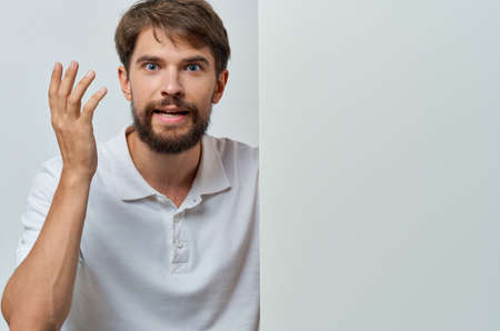 man in white shirt emotions white mockup presentation advertisingの写真素材