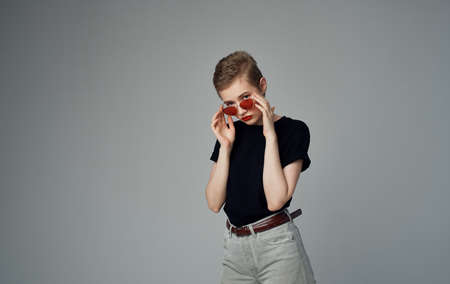 Beautiful woman sunglasses fashionable clothes elegant style short haircut Studioの写真素材