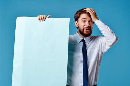 man in shirt with tie banners in the hands of an official advertising marketingの写真素材