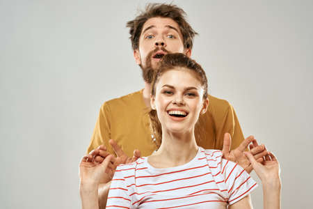 Young couple socializing romance lifestyle fashion fun light background