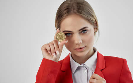 Business woman in red jacket cryptocurrency Bitcoin internet commerce financialの写真素材