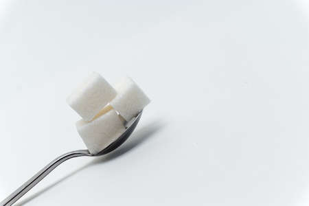 sugar cubes in a teaspoon sweets calorie ingredient Glucoseの写真素材