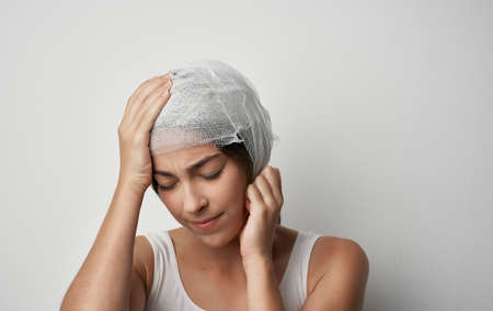 womans bandaged head injury health problem medicine
