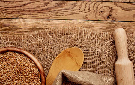 Organic porridge products in a plate of oatmeal kitchen utensils