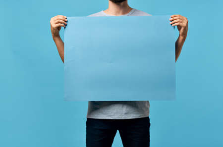 blue mockup poster men hands cropped view advertisementの写真素材