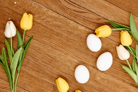 tulip easter eggs wooden background top Copy Spaceの写真素材