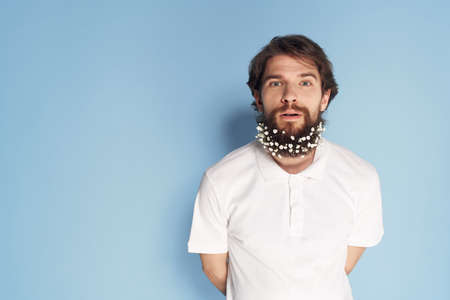 Bearded man white t-shirt barbershop blue background decorationの写真素材