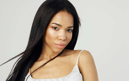 Pretty woman african appearance white tank top attractive look glamor model