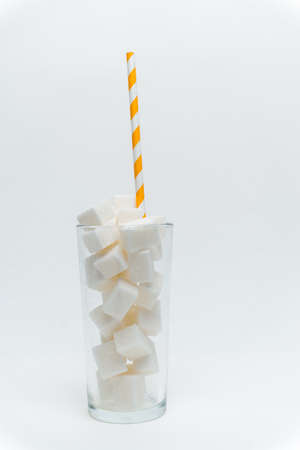 sugar cubes in a glass with a tube high-calorie cocktailの写真素材