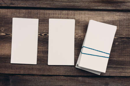 blank business cards on a wooden table Copy Space Mockupの写真素材