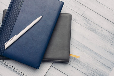 desktop notepad and documents office wooden background top viewの写真素材