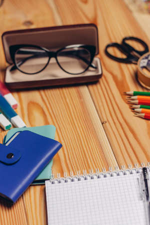 blue business card holder stationery multicolored markers notepad officeの写真素材