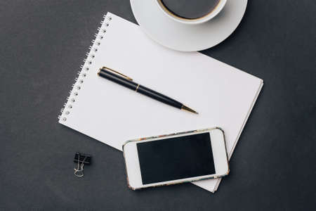work desk notepad with pen drink cup phone technology