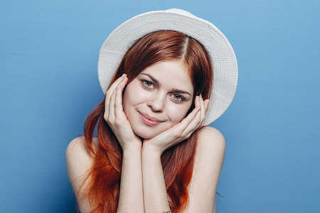 pretty red-haired woman wearing hat emotions attractive look cropped view fashionの写真素材