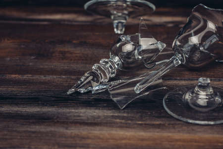 broken glass alcohol wine wooden background Shardsの写真素材