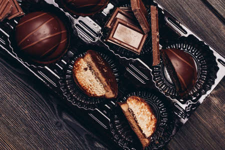 chocolate and pastries on wooden table background image texture delicacy dessertの写真素材