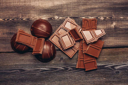 sweets chocolate cakes on a wooden table top view