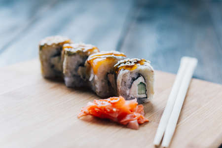 sushi chopsticks wood board sauce menu restaurantの写真素材