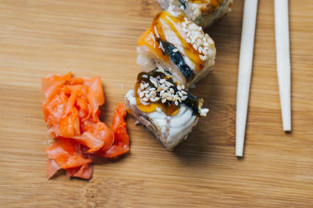 japanese cuisine sushi sauce chopsticks ginger wood boardの写真素材