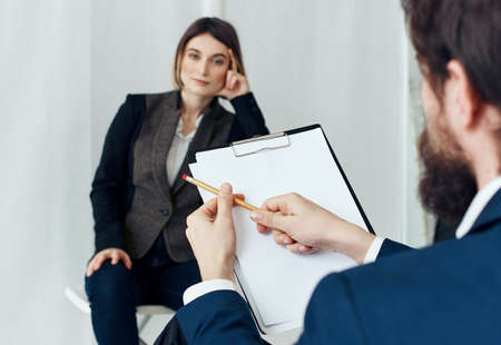 Woman for job interview and man with documents in the foregroundの写真素材