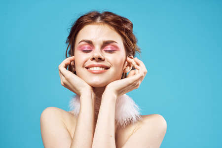 pretty woman luxury naked shoulders fluffy earrings bright makeupの写真素材