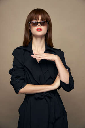 Sexy woman Gestures with hands Copy Space black coatの写真素材