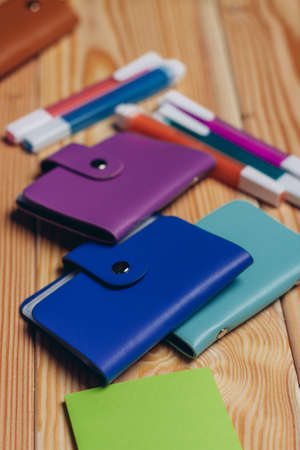 business card holders felt-tip pens stationery wooden table office documents