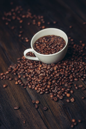 cup with coffee grains on a wooden table aromatic drink Arabica product