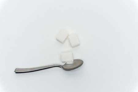 sugar cubes per teaspoon calories sweets light backgroundの写真素材
