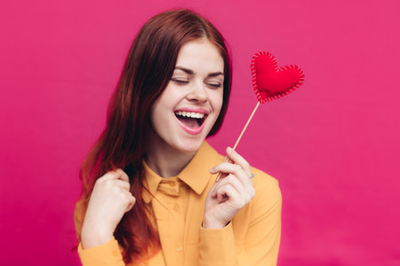 Valentines day feelings emotions woman and red heart on a stickの写真素材