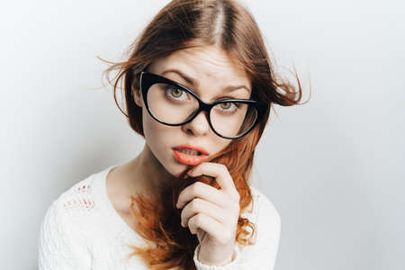 pretty woman with glasses red lips glamor modern style close-upの写真素材