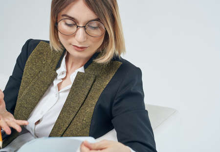 Woman In a bright room suit model business documentsの写真素材