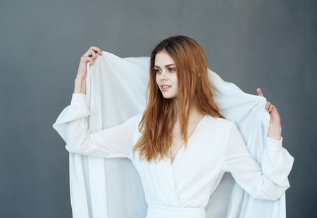 Beautiful woman in white dress glamor performance luxuryの写真素材