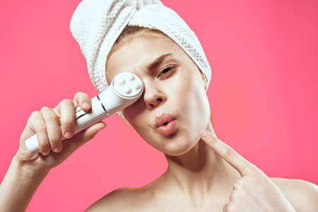 emotional woman naked shoulders facial massage cosmetologyの写真素材