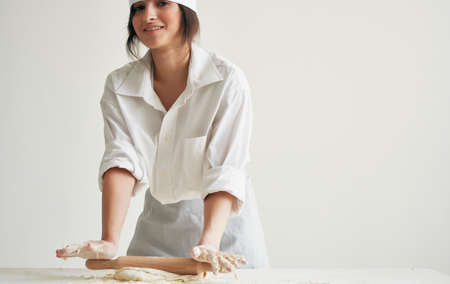 Woman chef preparing dough household healthy food