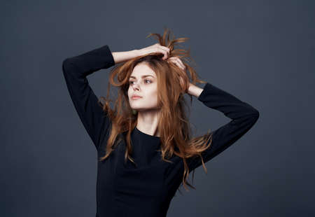 Beautiful woman elegant style hairstyle fashion glamor dark dressの写真素材