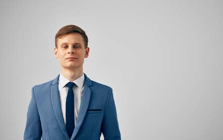 Man blue jacket tie manager official Professional gray backgroundの写真素材