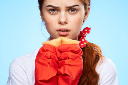 cleaning lady with a displeased expression with a rag in her hands housekeeping close-up